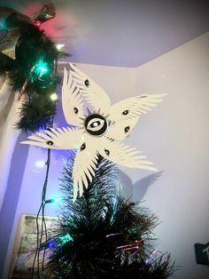 a christmas tree topper with an eye on it