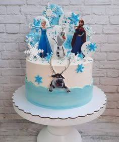 a frozen princess themed cake on a plate