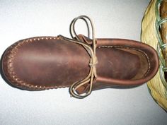 DO YOU WANT QUIET COMFORTABLE BOW HUNTING???This handmade moccasin is made of tough oil tanned cowhide with a thick inner sole but not so thick that you cant feel the texture of the ground under your feet. The fringe has been removed to eliminate the possibility of snagging and snapping twigs. Comfortable and rugged this moccasin will last for many seasons. Designed by a hunter for a hunter. Clothing Remakes, Mountain Man Clothing, Handmade Moccasins, Leather Patterns, Cottage Grove, Earth Shoes, Tan Cowhide, Moccasin Boots, Bow Hunting