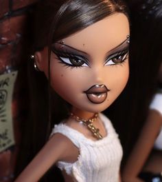 a close up of a doll with long hair and piercings on her nose, wearing a white dress