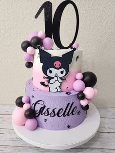 a cake decorated with balloons and an animal on it's top is the number ten