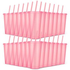 six pink cups with straws in them