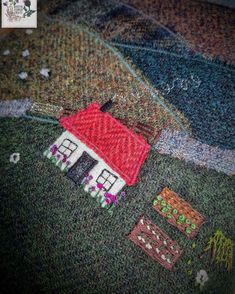 a close up of a house on a sweater