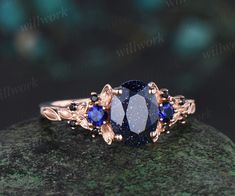 - Metal: Solid gold(10K/14K/18K white/yellow/rose gold),925 sterling silver,platinum available- Main Stone: 6x8mm pear lab blue sandstone- Accent Stone: lab sapphires and black spinels- Band Width: 1.4mm- Can be personalized: Yes Luxury Sapphire Ring With Black Spinel, Blue Sandstone Engagement Ring, Sandstone Engagement Ring, Rose Gold Leaf, Topaz Birthstone, Blue Sandstone, Engagement Ring Rose Gold, Ring Rose Gold, Black Spinel