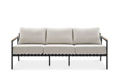 an outdoor sofa with four cushions and two arms, on a white background in front of a