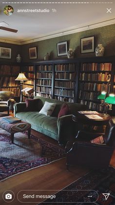 a living room filled with furniture and bookshelves covered in lots of bookcases