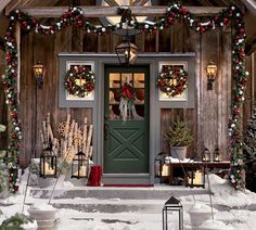 the front door of a house decorated for christmas