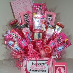 a pink box filled with candy and candies