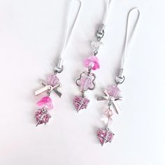 three pairs of pink and silver dangling earrings