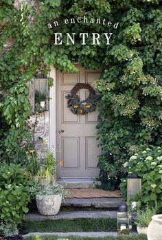 the front door to an enchanted entry surrounded by greenery