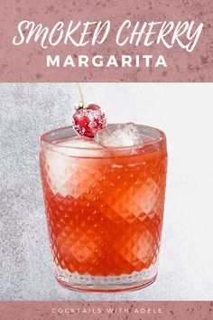 a cocktail in a glass with ice and a cherry on the top that says smoked cherry margarita