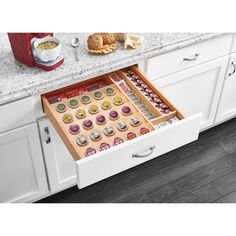 Keep your kitchen drawers clean and clutter-free with the 22'' K-Cup Solid Wood Custom Kitchen Drawer Insert from Rev-A-Shelf. This custom kitchen drawer insert measures 22'' by 19.75'' by 2.38'' and can help transform any ordinary drawer into a clean, accessible coffee or tea beverage station. With a Five-Tier durable wood construction with a clear finish, this accessory can hold 30 pods at once. Featuring extra utensil storage on the side, you'll be able to customize your cleaning needs. The t Custom Kitchen Drawers, Kitchen Drawer Inserts, Pod Storage, Coffee Pod Storage, Kitchen Drawing, Classic White Kitchen, Utensil Storage, Storage Shed Plans, Rev A Shelf