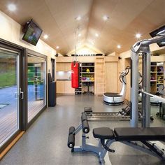 a home gym with exercise equipment and sliding glass doors