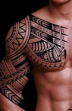 a man's chest with an intricate tattoo design on his arm and shoulder, in black