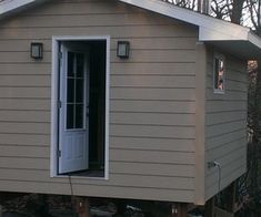 a small house with a door and window