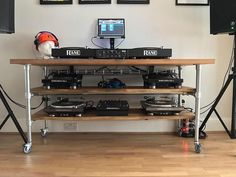 there is a dj's desk with two turntables and headphones on it