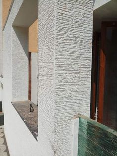 the corner of a building that has been painted white