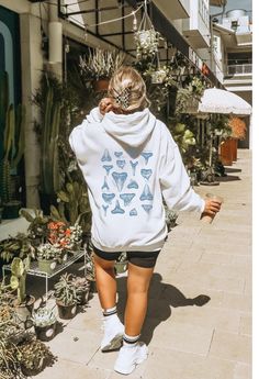 This "Respect the Locals" Shark hoodie by Gildan is perfect for beach lovers! This soft, high quality sweatshirt will keep you cozy and warm at the beach, post surfing, or chilling at home. Details 50% Cotton 50% Polyester (resistant to stretching and shrinking!) Front pouch pocket to keep your hands cozy and warm Knitted in one piece without side seams (reduces fabric waste!) Adjustable drawstring in hood Printed with non-hazardous, non-toxic, and biodegradable inks! SHIPPING Production time can take 2-7 business days, although the average time is 1.6 business days Shipping times in the US is 2-5 business days. *shipping to Alaska, Hawaii, Puerto Rico and unincorporated territories of the US can take an additional 7-12 business days. RETURNS Each sweatshirt is Print-on-Demand, meaning it Ron Jon Surf Shop Hoodie, Surfer Vibes Outfit, Hoodies Shark, Ocean Aesthetic Clothes, Ocean Themed Outfits, Respect The Locals Shark, Respect The Locals, Surfer Vibes, Beach Post