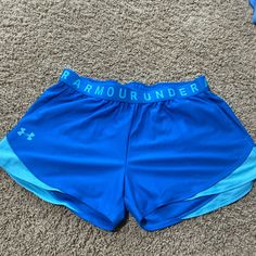 Never Worn, New With Tags Under Armour Summer Shorts With Pockets, Blue Under Armour Sports Shorts, Blue Under Armour Summer Shorts, Under Armour Blue Shorts For Summer, Under Armour Blue Sports Shorts, Sporty Blue Athletic Shorts By Under Armour, Sporty Blue Under Armour Athletic Shorts, Sporty Blue Under Armour Bottoms, Blue Under Armour Bottoms With Built-in Shorts