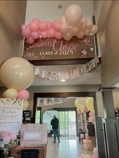 balloons and streamers decorate the entrance to a class graduation party at longrat's high school