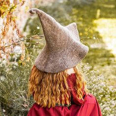 Light Brown Curly Tip Witch Hat with Brim - Wool | Sorceress / Wizard Hats Similar to our other witch hats, but with a curled tip and more texture to the fabric. Vintage woolen felt, curled-tip, wide-brim witch hat. One size fits all. For men or women. Dry clean only. Material: 100% Wool.Color: Light Brown. Worldwide shipping available!Custom made to order: Please allow up to 1-3 weeks before item ships. Share: Wizard Hats, Medieval Pants, Medieval Shirt, Medieval Tunic, Horns Decor, Beard Beads, Brown Rings, Bead Hair Accessories, Viking Clothing