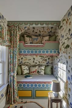 a bed room with a neatly made bed next to a window and curtains on the windowsill