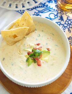 a bowl of quesadilla dip with tortilla chips on the side