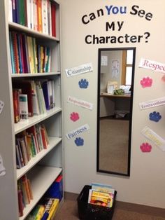 a room with a book shelf, mirror and sign on the wall that says can you see my character?