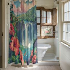 a bathroom with a shower curtain that has flowers on it and a waterfall in the background