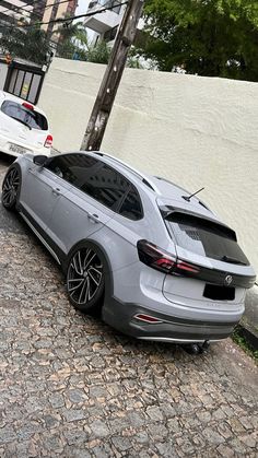 two cars parked next to each other on the street