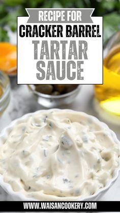 a white bowl filled with tartar sauce on top of a table