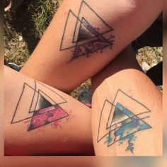 two people with tattoos on their legs