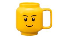 a yellow mug with a smiley face on it's front and side, sitting in front of a white background