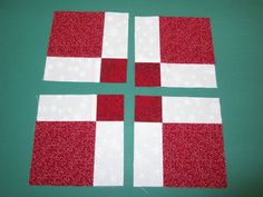 the block is made up of red and white squares, which are arranged in four different directions