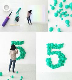 there is a woman standing in front of the number five made out of balloons and balls