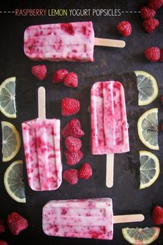 raspberry lemon yogurt popsicles on a baking sheet