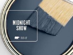 a paint can with the words midnight show on it and an image of a brush