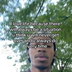 a young man looking up at the sky with trees in the background and text that reads, i love life because there will always be a situation u