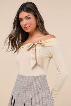 Classy and chic, the Motel Orianne Pale Yellow Off-the-Shoulder Bow Sweater Top will make sure that all your looks are on-trend this season! Stretchy and soft sweater knit shapes this must-have top that features cozy long sleeves, a fitted bodice, and a timeless off-the-shoulder neckline with fold-over trim and a darling satin bow detail at the side. Contrasting ribbed knit accents the neckline and cropped hem. Fit: This garment fits true to size. Length: Size medium measures 16.50" from top to bottom. Bust: Great for any cup size. Waist: Fitted - stretchy fabric allows custom fit. Undergarments: May be worn with a strapless bra, adhesive bra, petals, or no bra. Fabric: Fabric is very stretchy. Unlined. 23% Nylon, 77% Polyester. Hand Wash In Cold Water. Wash Separately. Do Not Soak. Do Not Bow Sweater, Bow Top, Adhesive Bra, Soft Sweater, Satin Bow, Softest Sweater, Strapless Bra, Pale Yellow, Sweater Knit