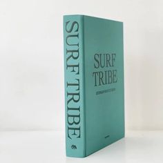 a book with the title surf tribe written on it