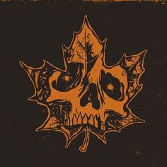 an orange and black maple leaf with skulls on it's back end is shown