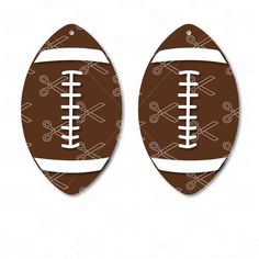 two footballs with crossed bats on them, one is brown and the other is white