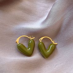 Everyday Earrings to Match with Any Attire Show yourself some love with these heart earrings dipped in gold. Irresistibly cute, these heart earrings are a perfect pair for a fun night out. Details• Size: 20mm x 18mm • 14k Gold plated• Resin-crafted Hearts• Handcrafted Cheap Retro Everyday Earrings, Small Green Earring, Cheap Vintage Everyday Earrings, Affordable Quirky Green Earrings, Cheap Green Artsy Jewelry, Cheap Green Heart Earrings Gift, Show Yourself, Heart Earring, Love Earrings