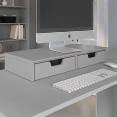 an apple desktop computer sitting on top of a desk next to a keyboard and mouse