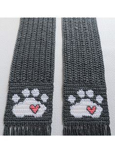 two crocheted scarfs with hearts and paw prints