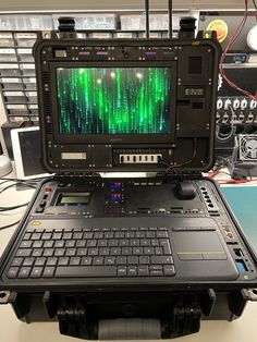 an open laptop computer sitting on top of a table