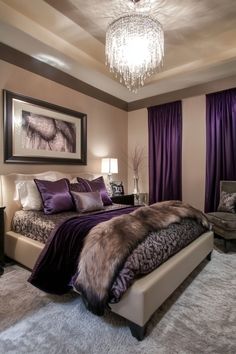 a bedroom with purple curtains and a large bed in front of a chandelier