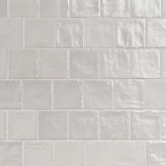 a white tile wall that is very clean