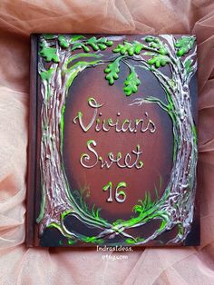 a close up of a cake on a bed with the words, vitamin sweet 16