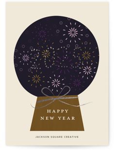 a happy new year card with an image of fireworks in a snow globe on it